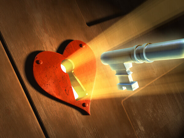 a key unlocking a heart shaped lock